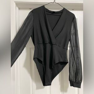 Black bodysuit. V neck. Sheer long sleeves